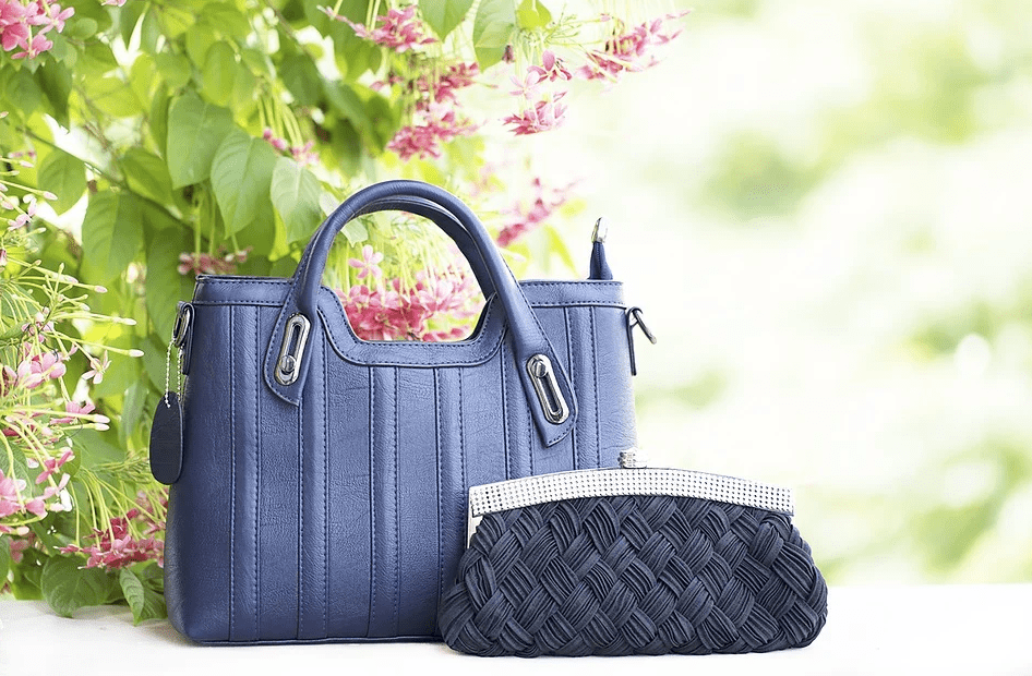 a blue hand bag and a blue purse